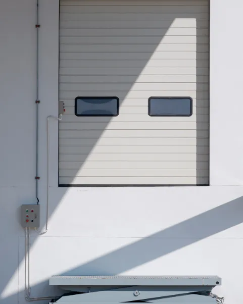 On the other hand, shelters use a flexible fabric curtain that is mounted to a frame (to provide a protective enclosure around the trailer). They accommodate trailers of many sizes, while also offering greater flexibility for loading operations.